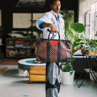 RED REDEMPTION PYRAMID DUFFLE