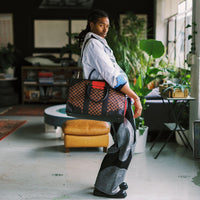 RED REDEMPTION PYRAMID DUFFLE