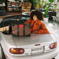 RED REDEMPTION PYRAMID DUFFLE