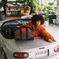 RED REDEMPTION PYRAMID DUFFLE