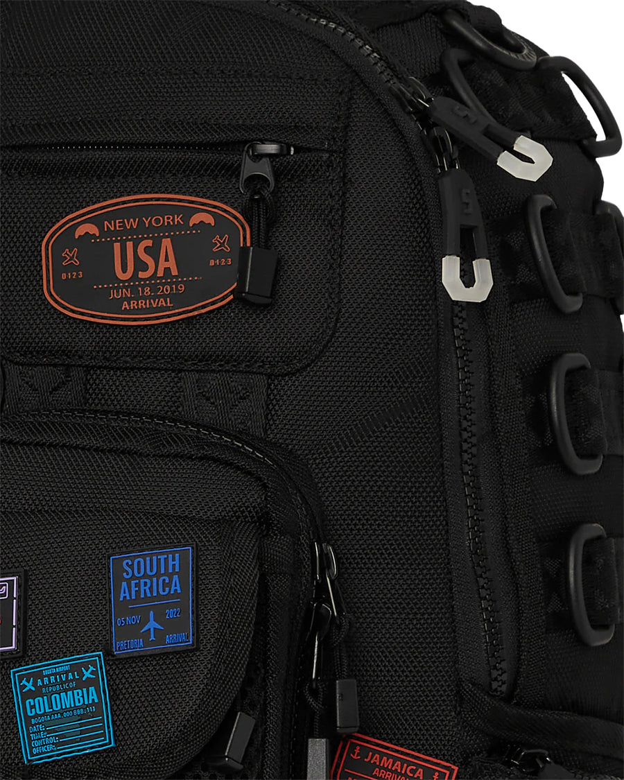 Sac à dos Sprayground JAMES PASSPORT STAMPS SPECIAL OPS BACKPACK 