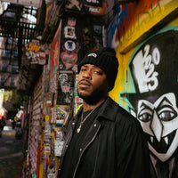 BLACK KNIT PUFF BEANIE