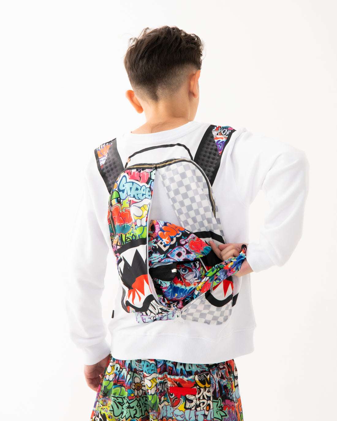 SPRAYGROUND WRITERS BACKPACK IN THE WHITE CREWNECK