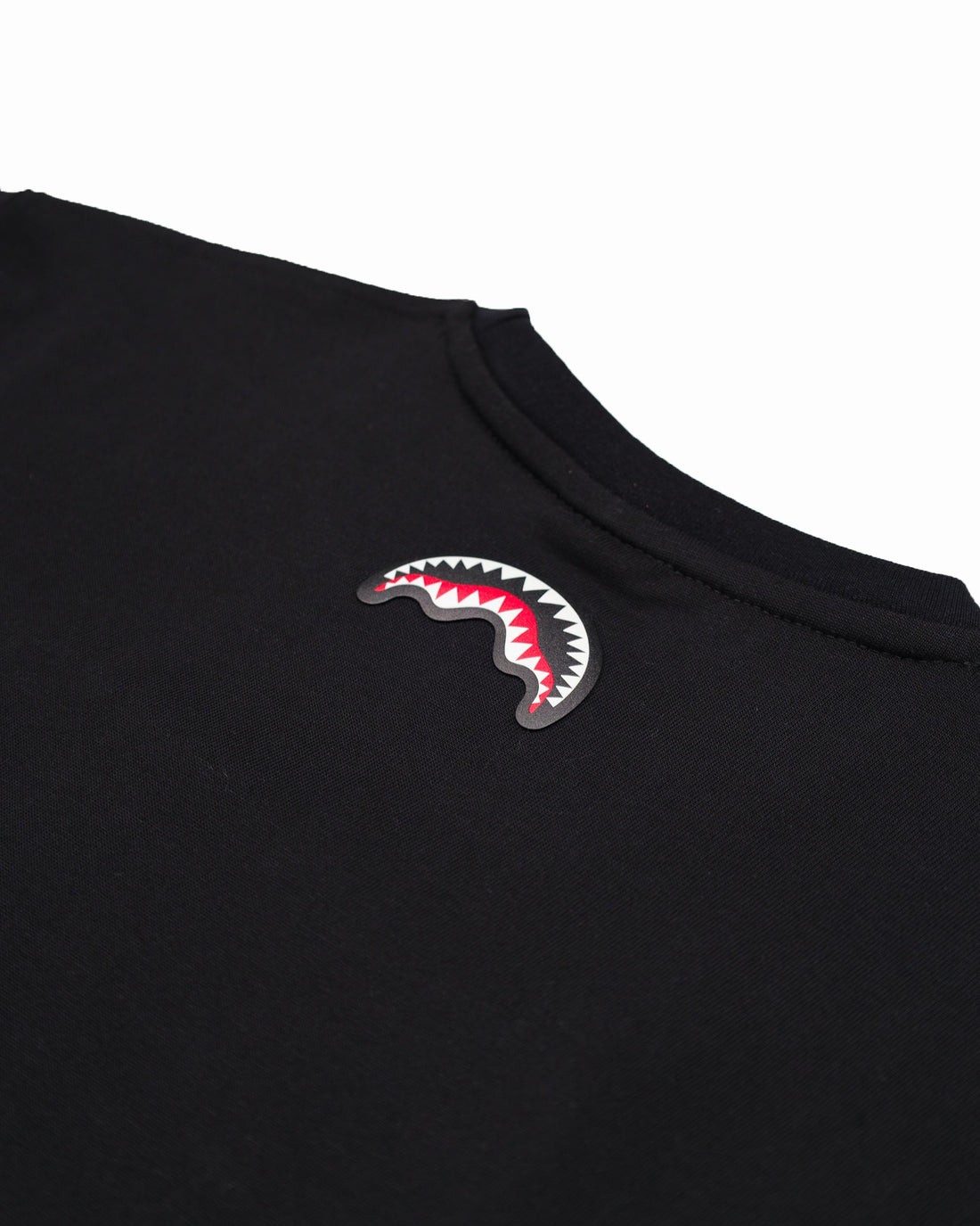 MAKES THE WORLD GO ROUND BLACK OVER T-SHIRT