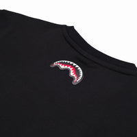 MAKES THE WORLD GO ROUND BLACK OVER T-SHIRT